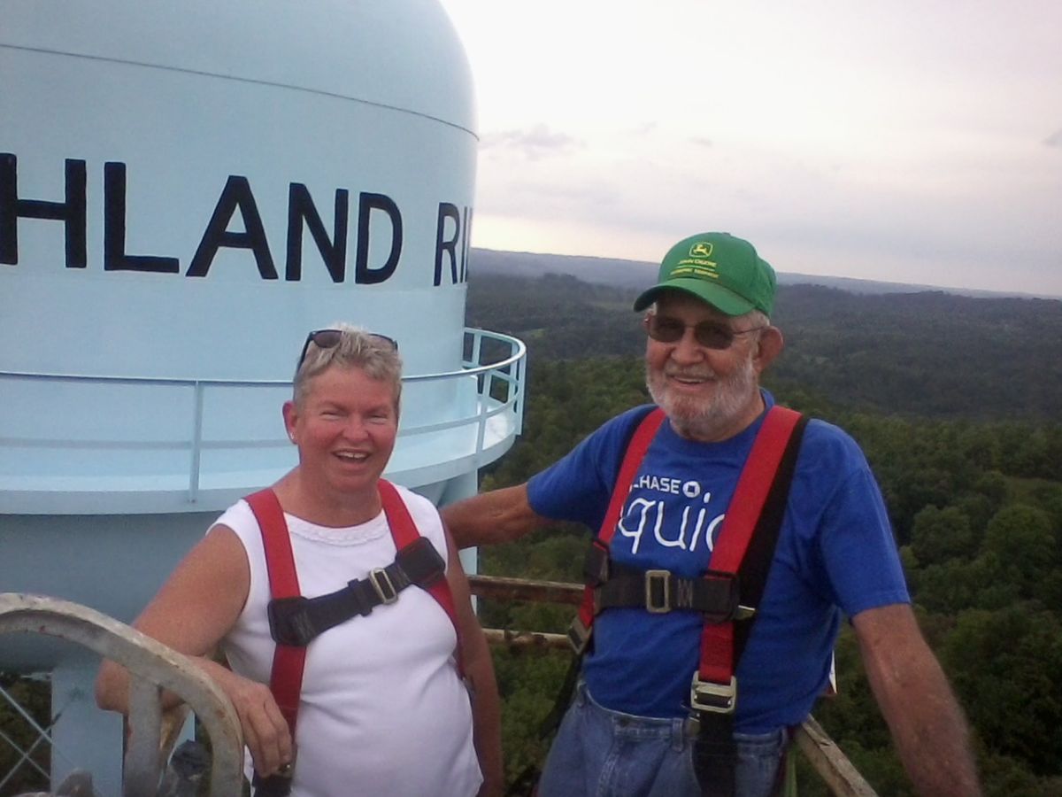 Judy and Harold, all smiles on top the tank. 